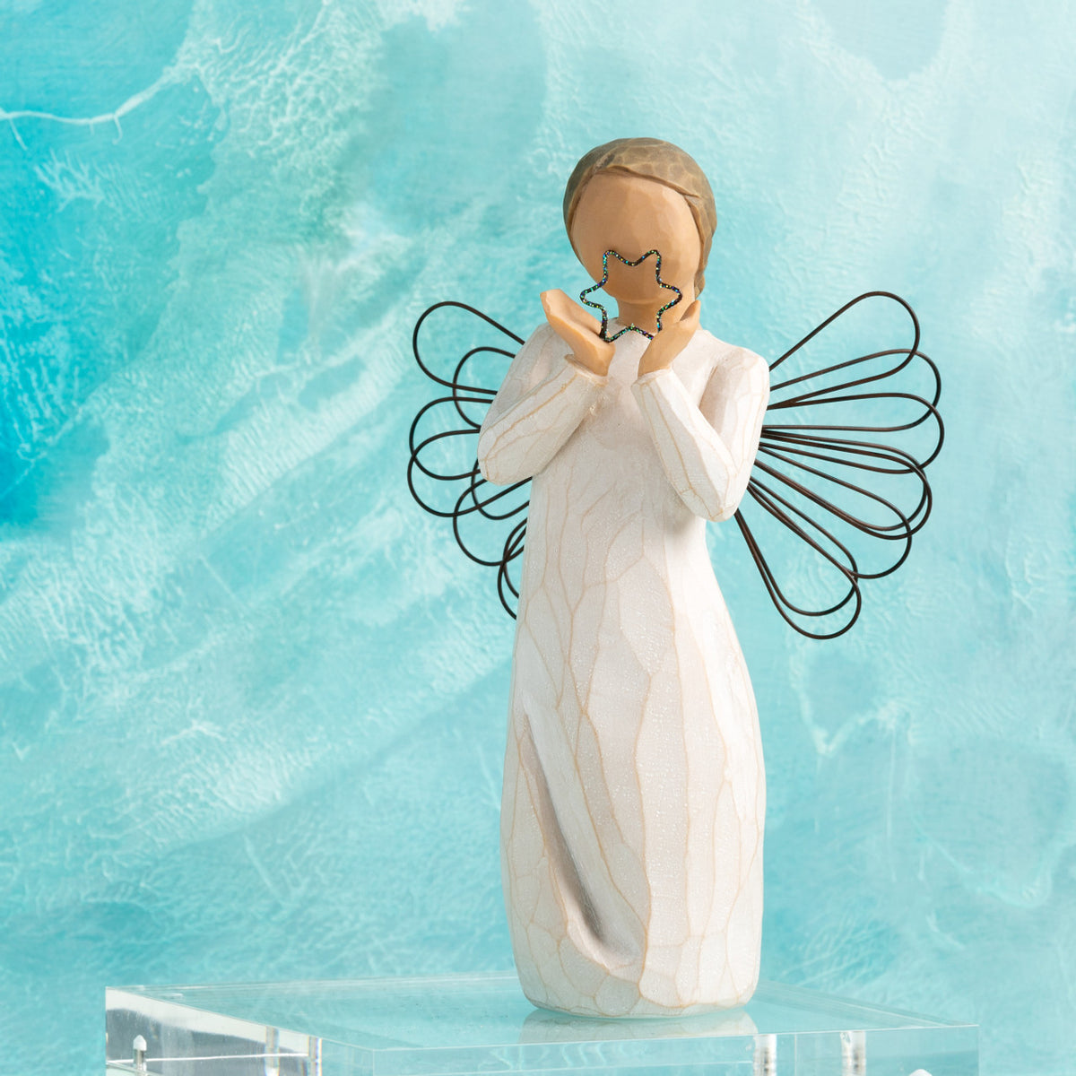 Willow Tree Bright Star, 6”h hand-painted standing resin angel figure in cream dress with wire wings, holding glittered wire star, in front of aqua painting