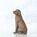 Brown wooden dog sitting figurine
