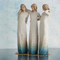 Willow Tree By my side, 9.5" hand-painted resin sculpture of 3 women standing, arms around each other, all in cream and blue ombré dresses with gold-leaf dots, on gold-leaf metal base, in front of pale blue painting