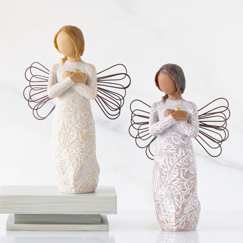 Lighter &amp; Darker skin versions of angel with wire wings, arms crossed over gold heart, carved with symbols of remembrance
