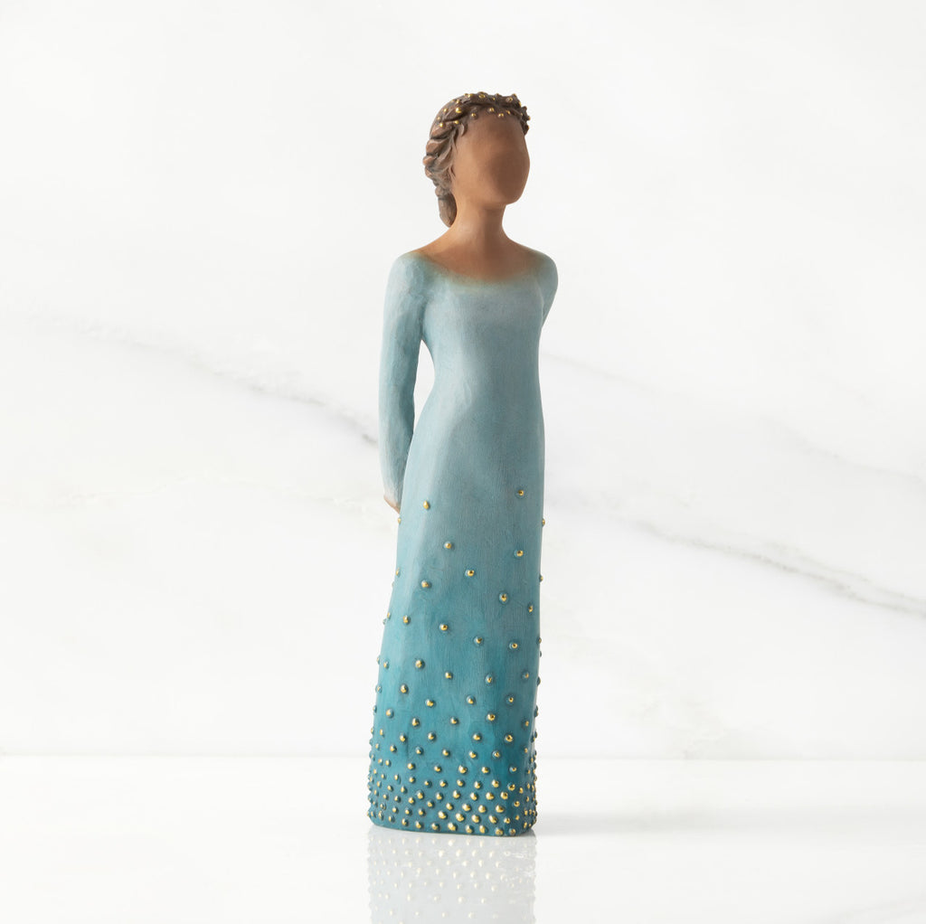 Facing center/right: Darker-skin figure, arms clasped behind back, hair and deep blue ombré garment dotted with gold leaf