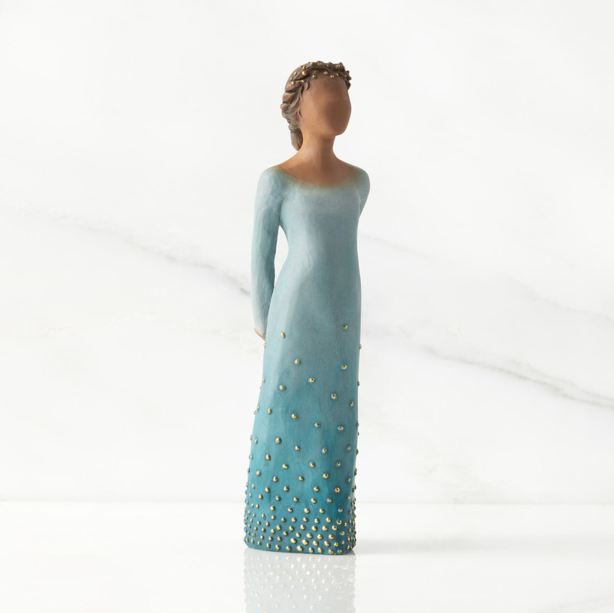 Facing center/right: Darker-skin figure, arms clasped behind back, hair and deep blue ombré garment dotted with gold leaf