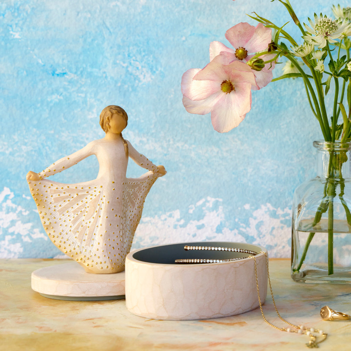 Willow Tree Butterfly Keepsake Box, 6.5"h x 4.5"h hand-painted oval resin box, 4.75”h figure holding cream skirt with carvings of monarch butterfly affixed to lid, open with jewelry inside